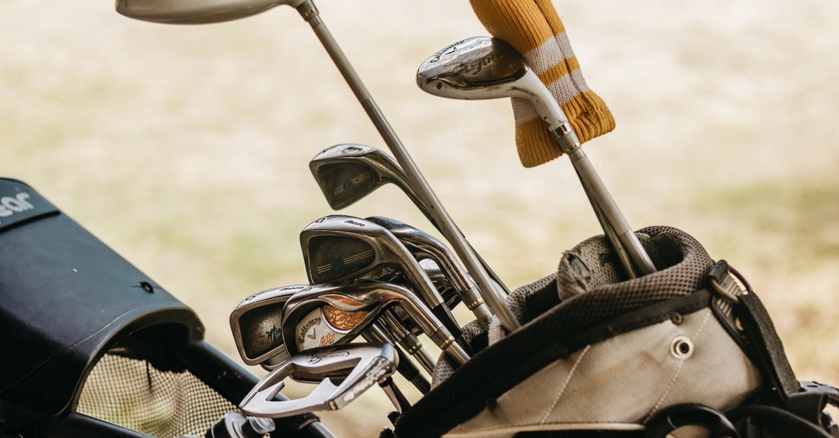 A detailed close-up of golf clubs in a bag, perfect for sports enthusiasts.